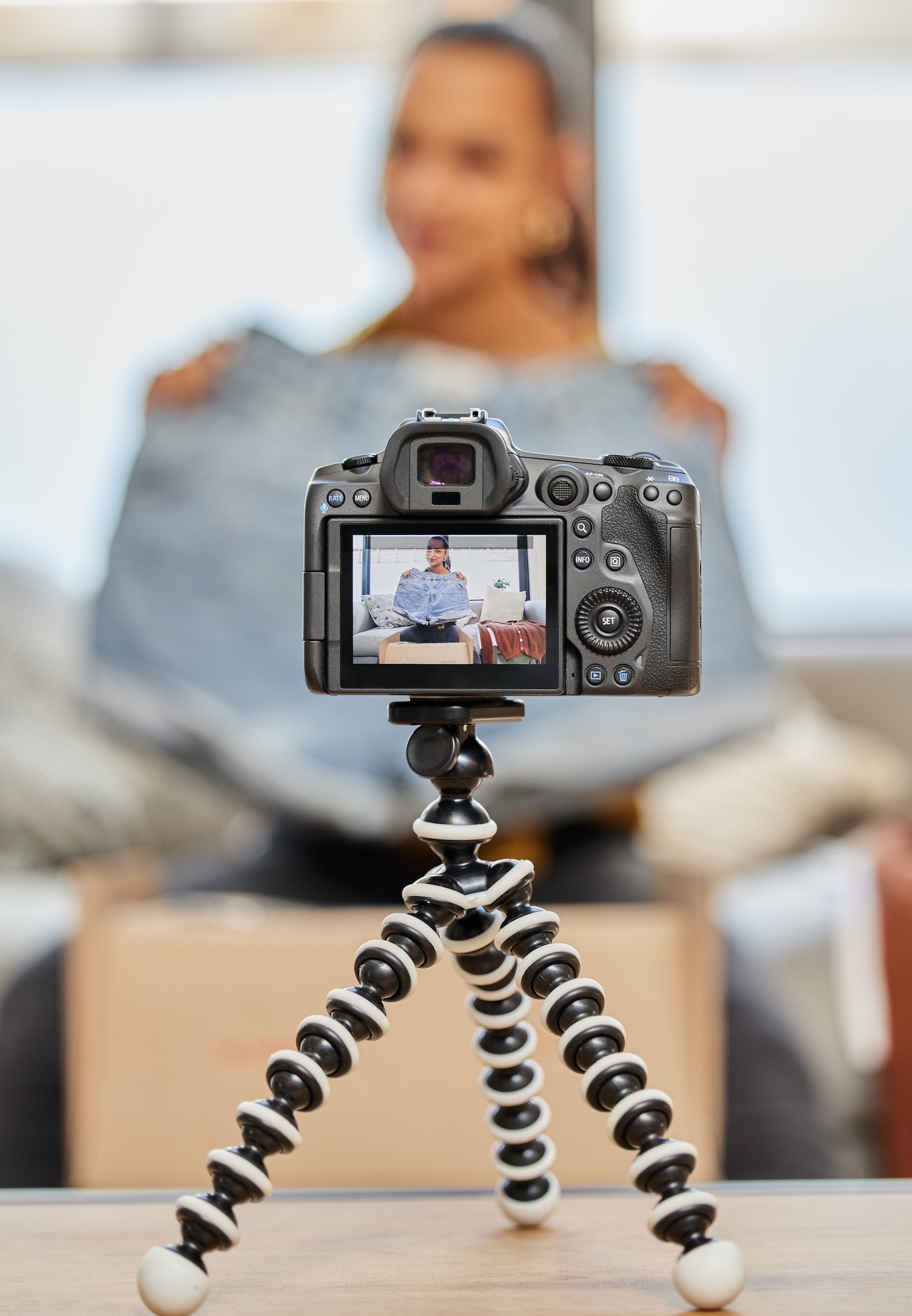 Shot of a young woman recording a video for her vlog at home