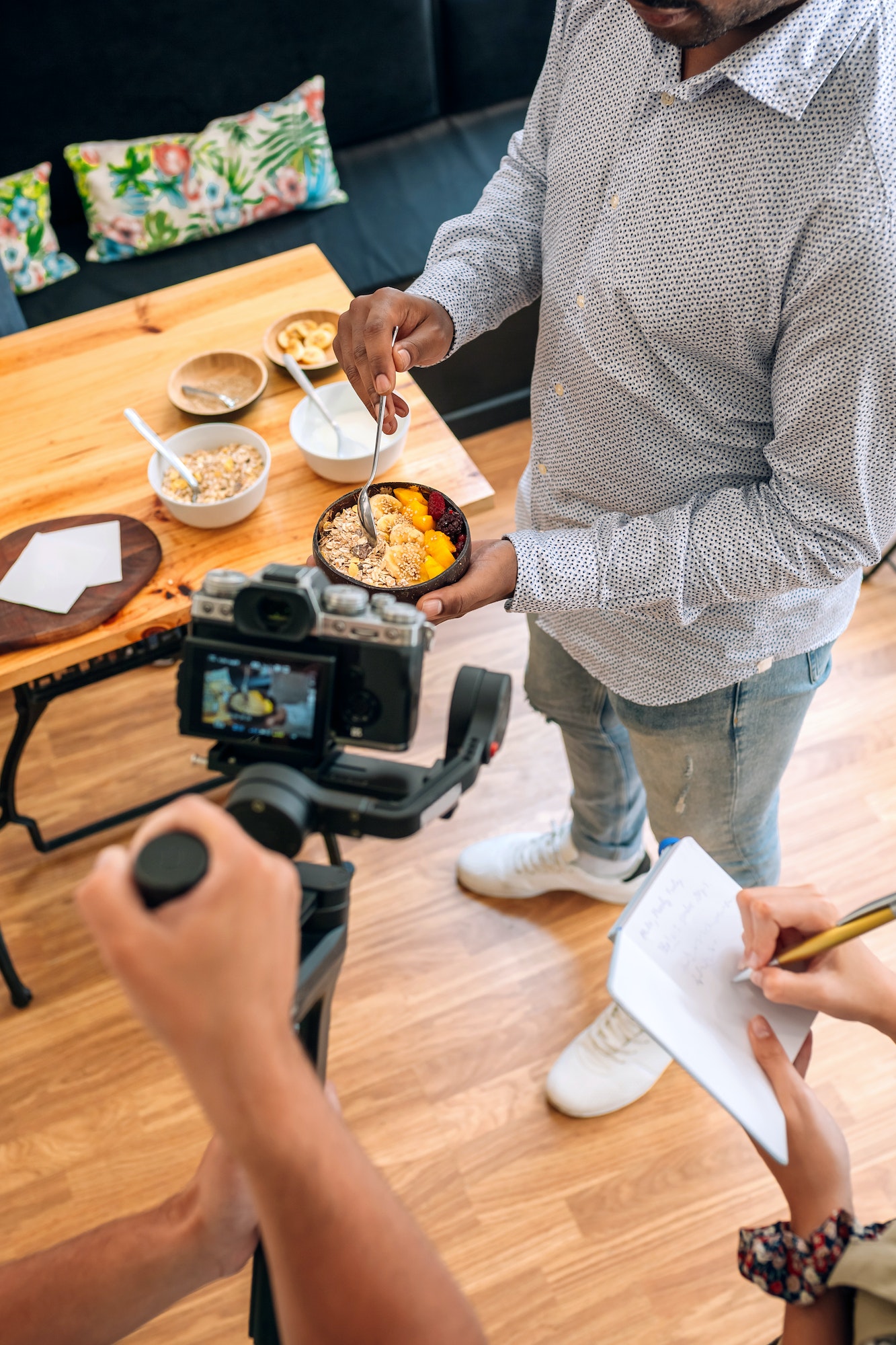 Unrecognizable blogger making a cooking video tutorial